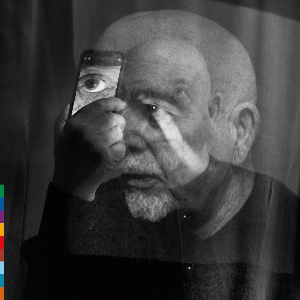 the album cover for Peter Gabriel - o\i [Indie Exclusive Dark-Side Mix Neon Purple]