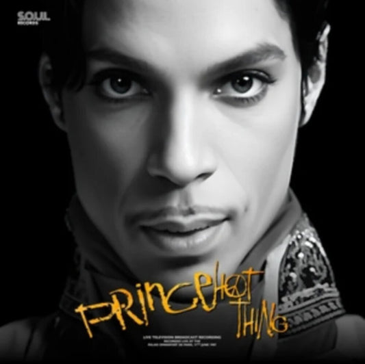 the album cover for Prince & The Revolution - Hot Thing - Purple Colored Vinyl